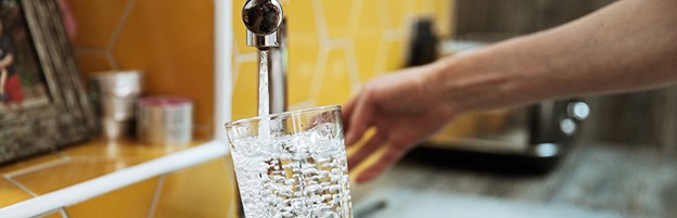 Image of Man Pouring Water - CBM CONNECT