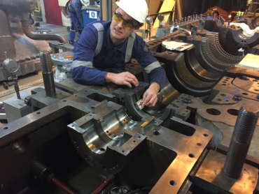 Engineer performing maintenance on rotating equipment